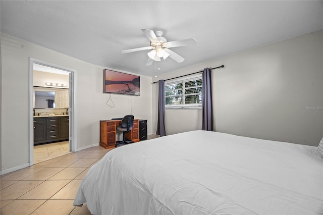 tiled bedroom featuring ensuite bath and ceiling fan