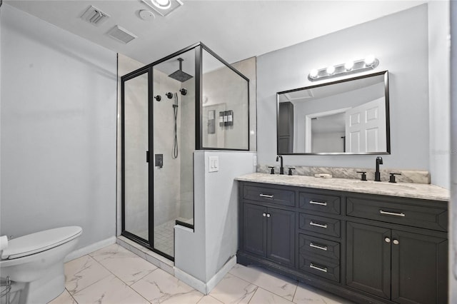 bathroom featuring vanity, toilet, and a shower with shower door