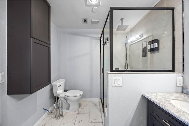 bathroom featuring vanity, toilet, and a shower with shower door