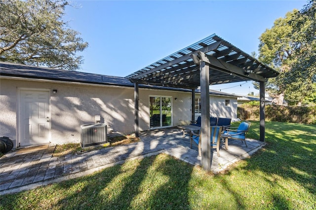 exterior space featuring a lawn, cooling unit, a patio area, and a pergola