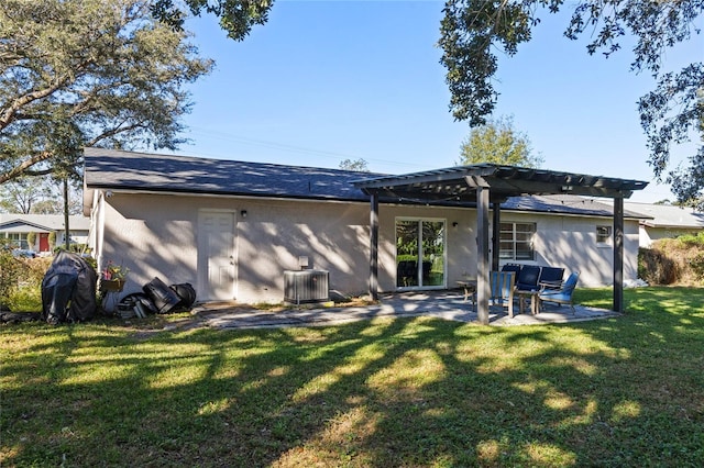 back of property with a pergola, central AC, a lawn, and a patio