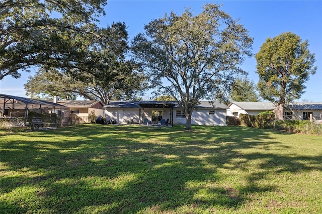 view of yard with a lanai