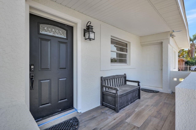 property entrance featuring a porch