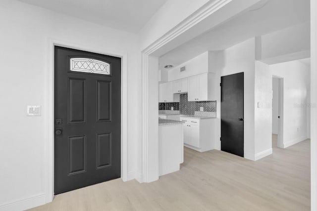 entryway with light wood-type flooring