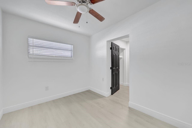 empty room featuring ceiling fan and light hardwood / wood-style floors