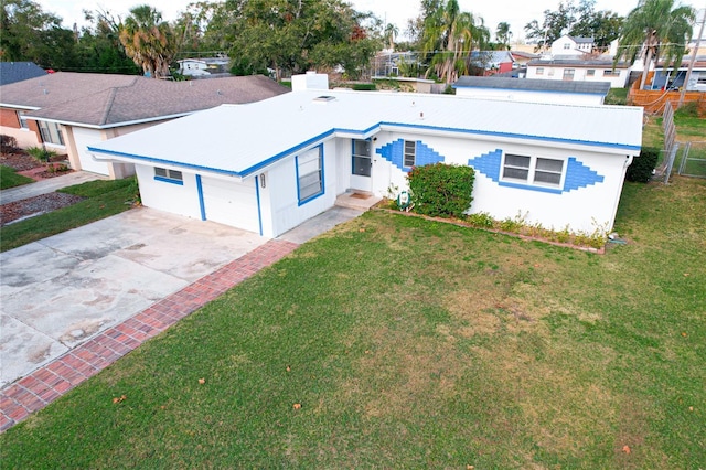 single story home with a front yard and a garage