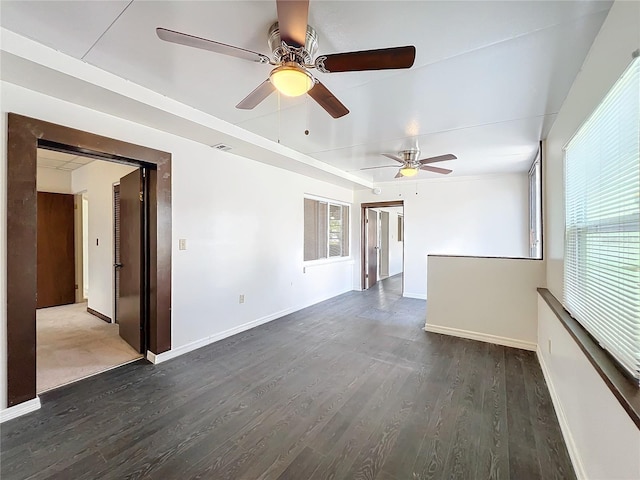 spare room with dark hardwood / wood-style floors and ceiling fan