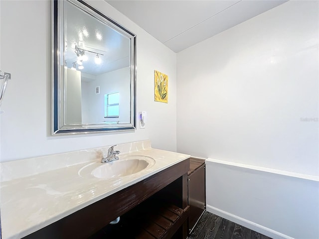 bathroom featuring hardwood / wood-style floors and vanity