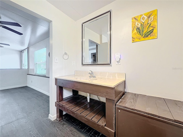 bathroom with hardwood / wood-style flooring, ceiling fan, and sink