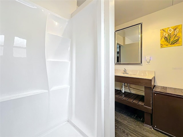 bathroom featuring wood-type flooring and vanity