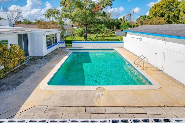 view of swimming pool with a patio area