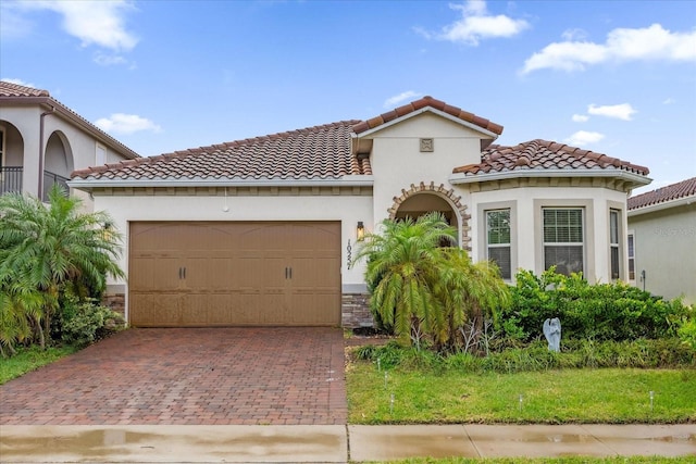 mediterranean / spanish-style home featuring a garage