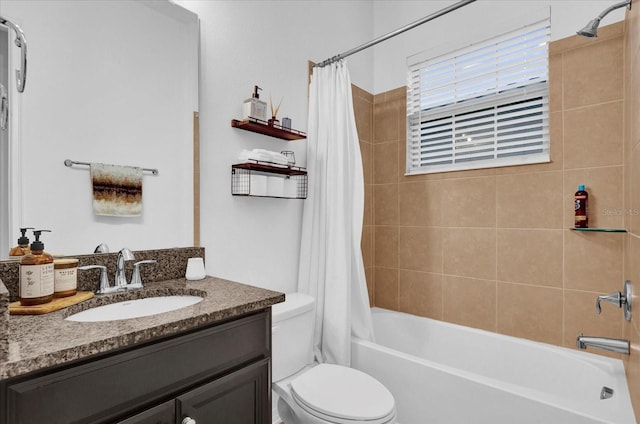 full bathroom featuring toilet, vanity, and shower / tub combo with curtain