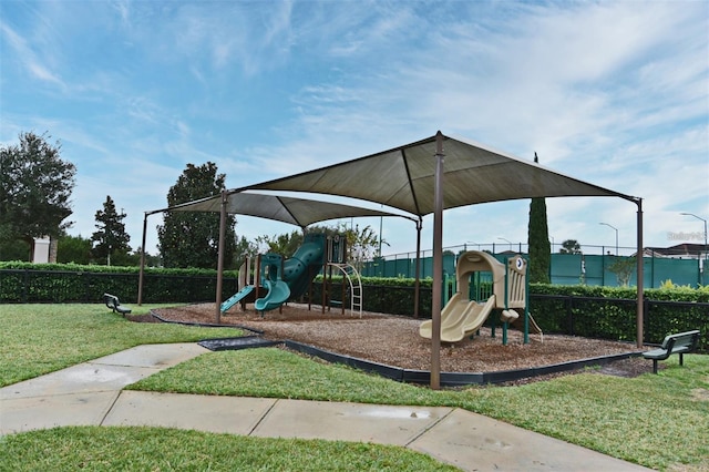 view of play area featuring a lawn