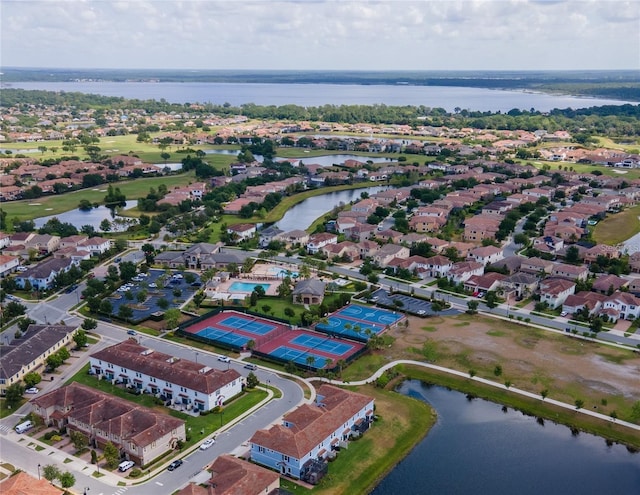 birds eye view of property with a water view