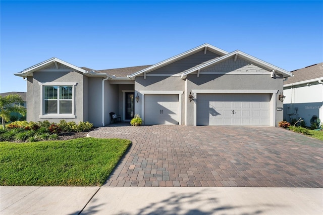 single story home with a garage and a front lawn