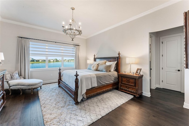 bedroom with dark hardwood / wood-style floors, a water view, ornamental molding, and a chandelier