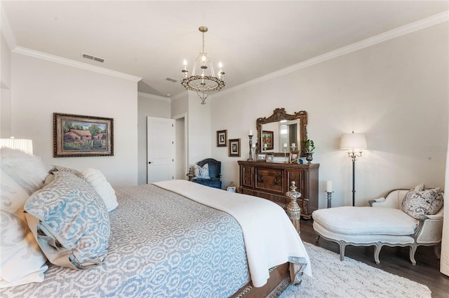 bedroom featuring a chandelier, hardwood / wood-style flooring, and crown molding