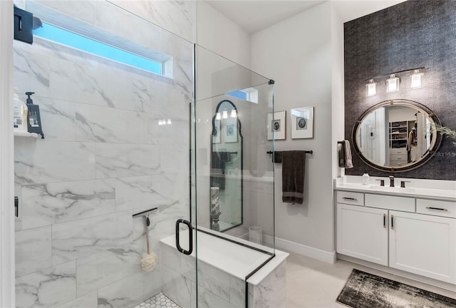 bathroom with vanity and walk in shower