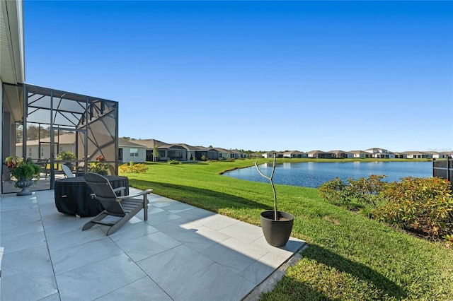 view of patio / terrace with a water view and a lanai