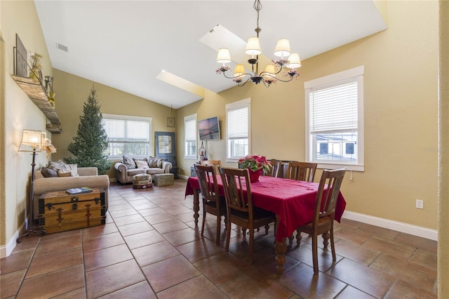 dining room featuring a chandelier and lofted ceiling