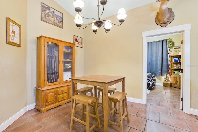 tiled dining area featuring a chandelier