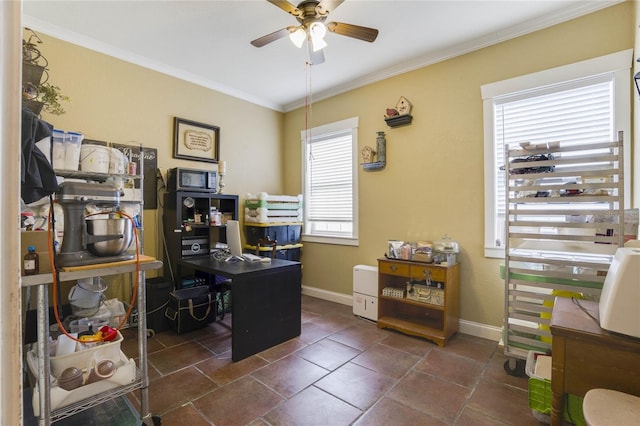 office space with ceiling fan and crown molding