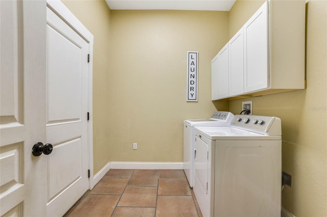 washroom featuring cabinets, independent washer and dryer, and light tile patterned flooring