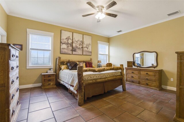 tiled bedroom with multiple windows, ceiling fan, and ornamental molding