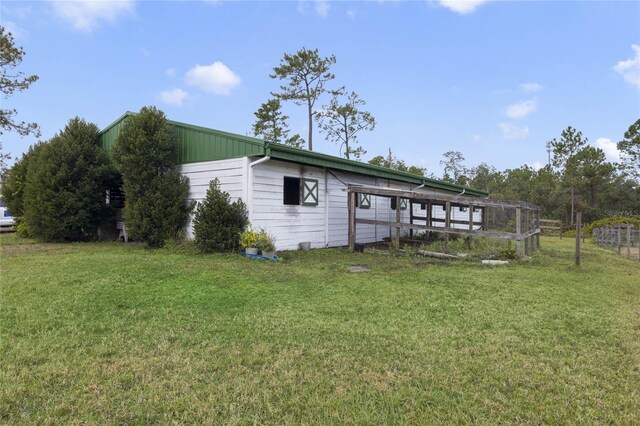 view of outdoor structure featuring a yard