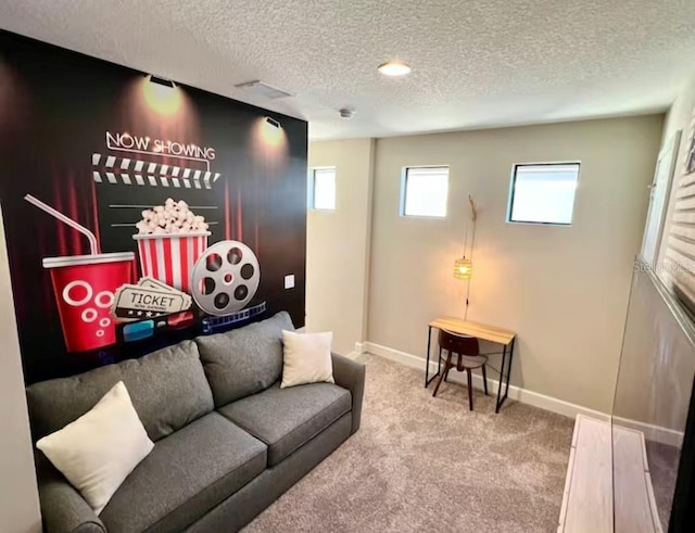 living room featuring carpet flooring and a textured ceiling