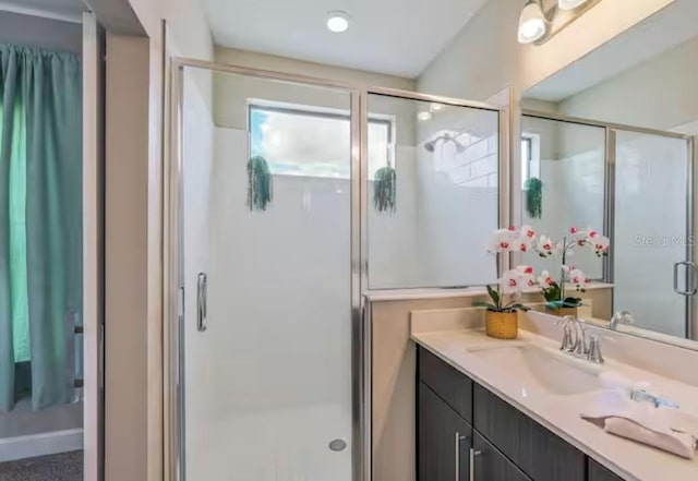 bathroom with vanity and walk in shower