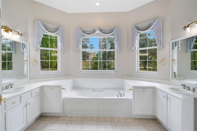 bathroom with tile patterned floors, vanity, and a tub