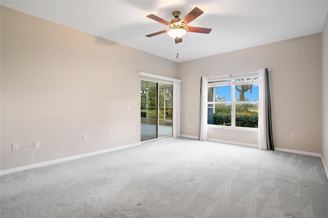 carpeted empty room with ceiling fan