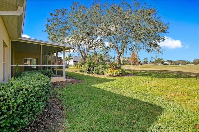 view of yard with a sunroom