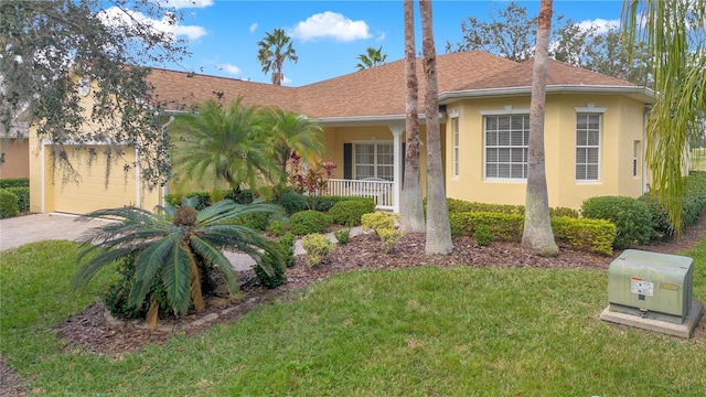 view of front of house with a front lawn and a garage