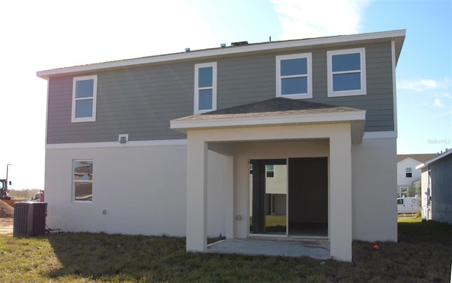 rear view of property with central air condition unit