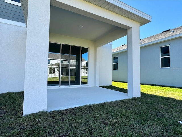 exterior space featuring a yard and a patio area