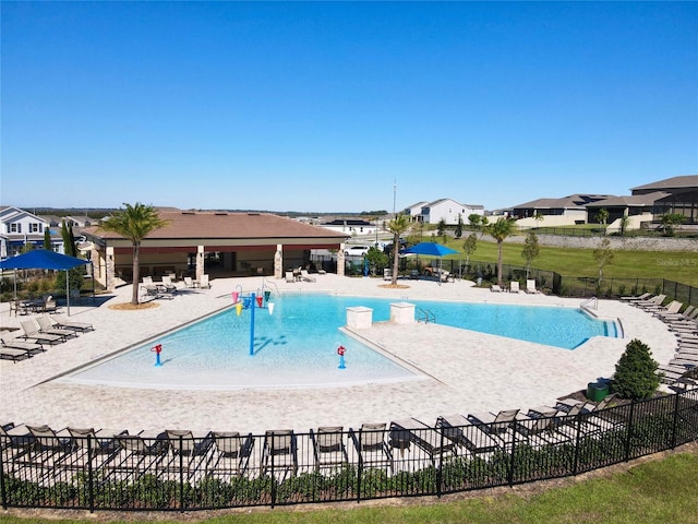 view of swimming pool featuring a patio area