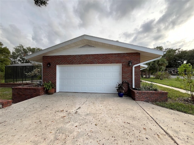 view of side of home featuring a garage