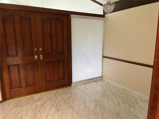 entryway featuring a chandelier