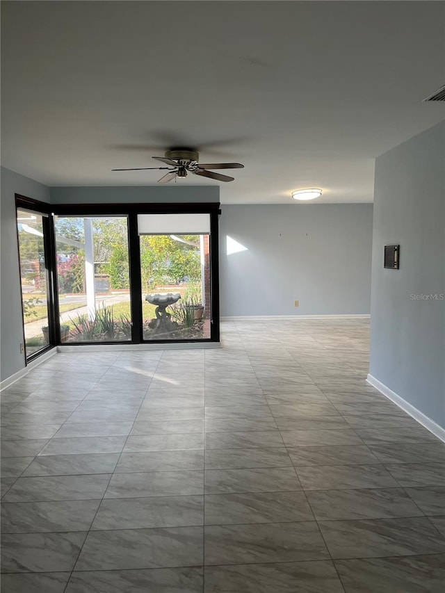 unfurnished room with ceiling fan