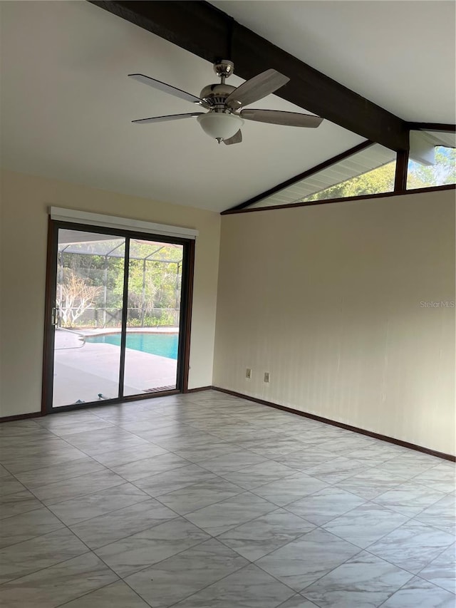 spare room featuring lofted ceiling with beams and ceiling fan