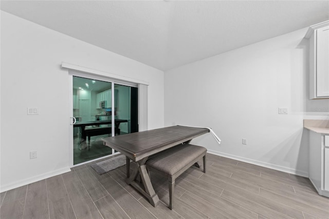 dining space featuring light wood-type flooring