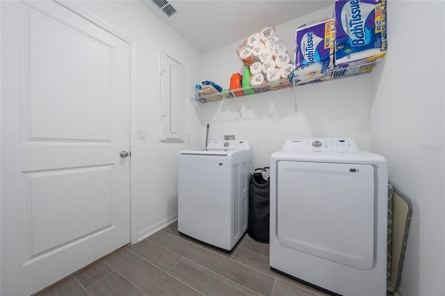 laundry area with separate washer and dryer