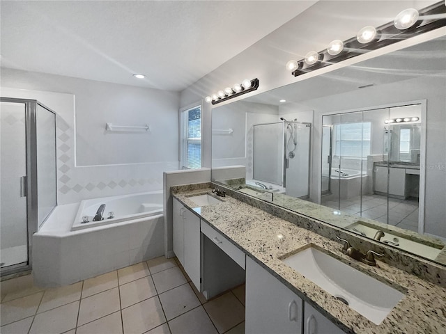 bathroom featuring tile patterned floors, vanity, a healthy amount of sunlight, and separate shower and tub