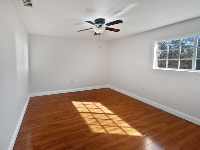 empty room featuring dark hardwood / wood-style floors