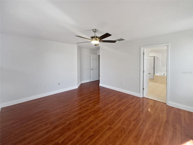 unfurnished room featuring hardwood / wood-style floors and ceiling fan