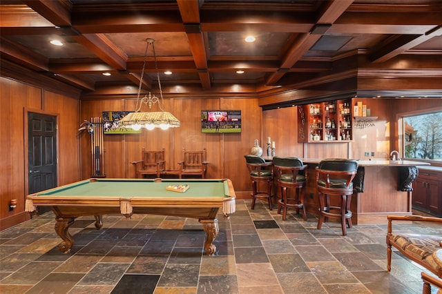 rec room with beamed ceiling, bar, and coffered ceiling