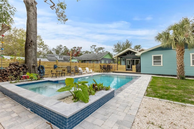 view of pool featuring a patio area, fence, and a fenced in pool